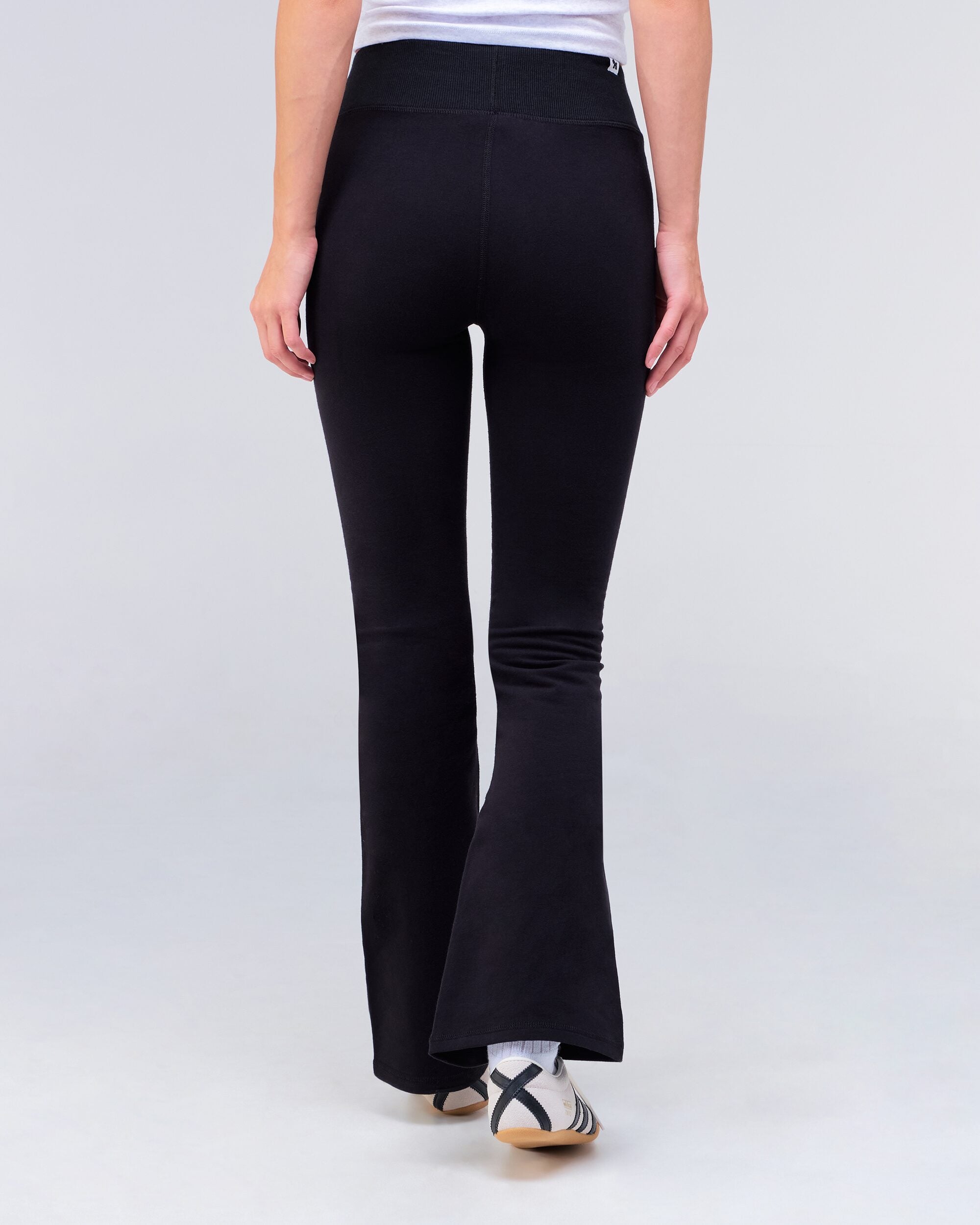 Edith fitted low rise flare pant in black, back view