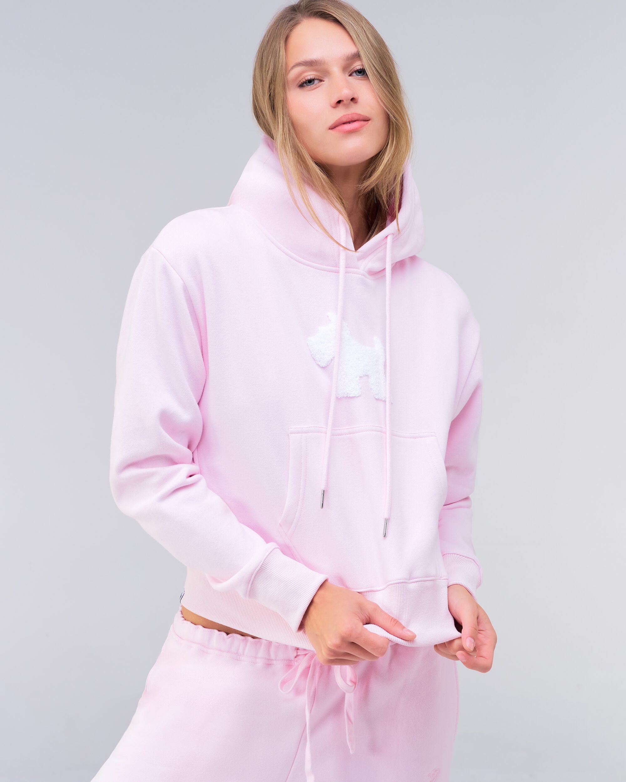 Emely cropped pullover hoodie in baby pink, three-quarter front view