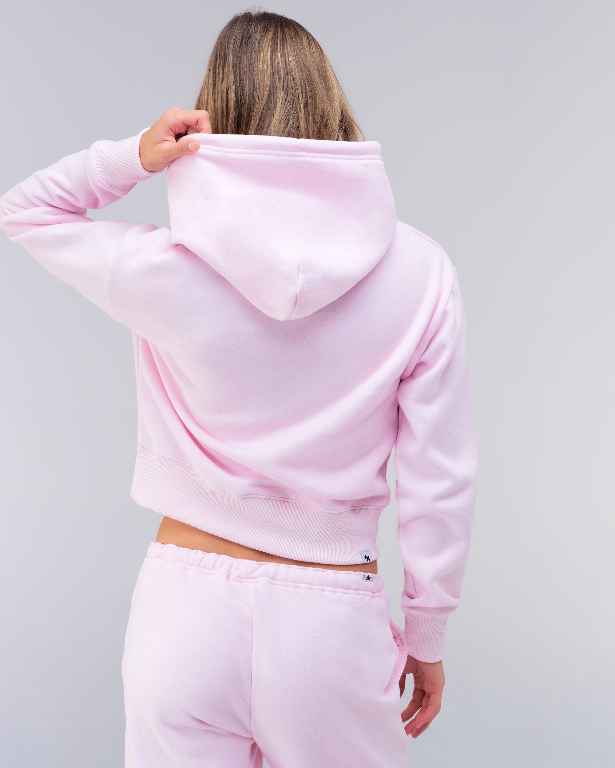 Emely cropped pullover hoodie in baby pink, back view of hood