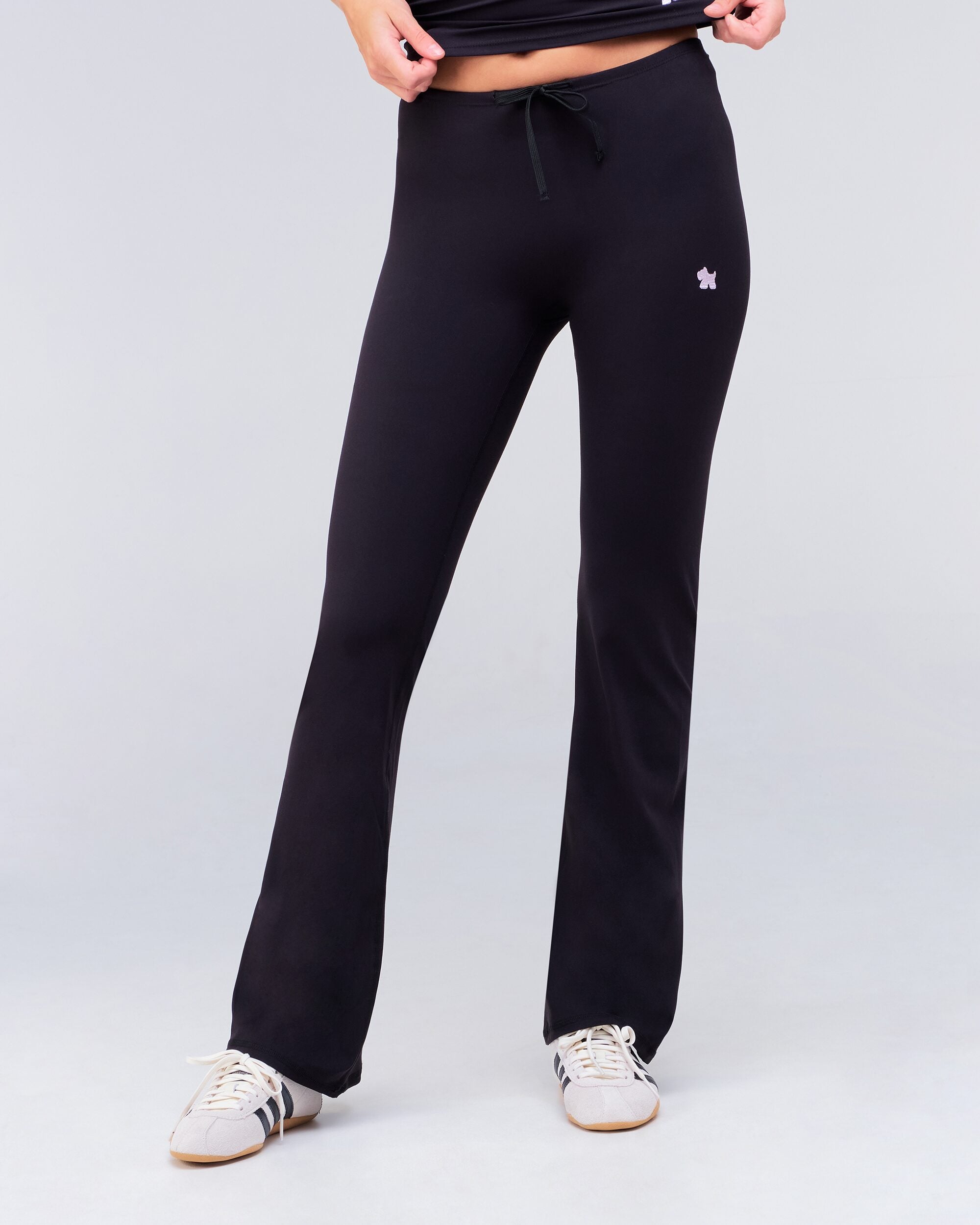 Adley fitted low rise drawstring flare pants in black, full length front view