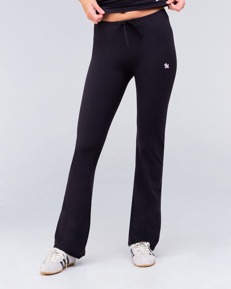 Adley fitted low rise drawstring flare pants in black, full length front view