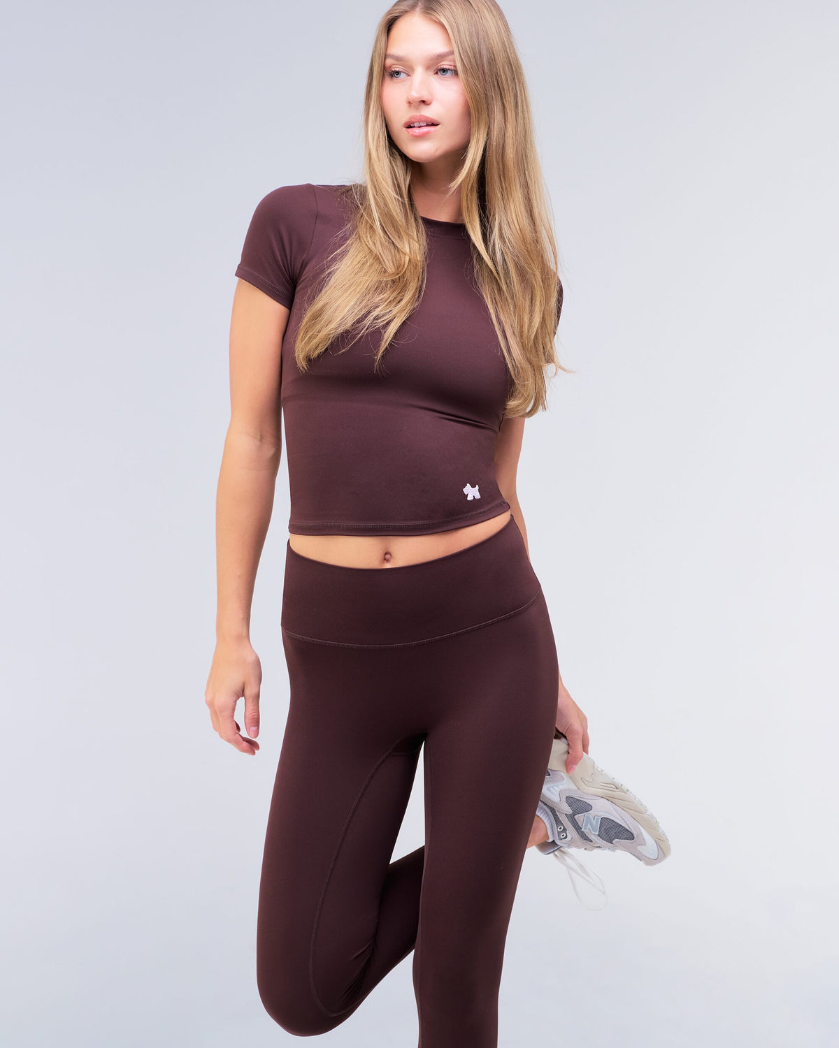Nicole fitted crew neck tee in auburn, three-quarter view with leg raised
