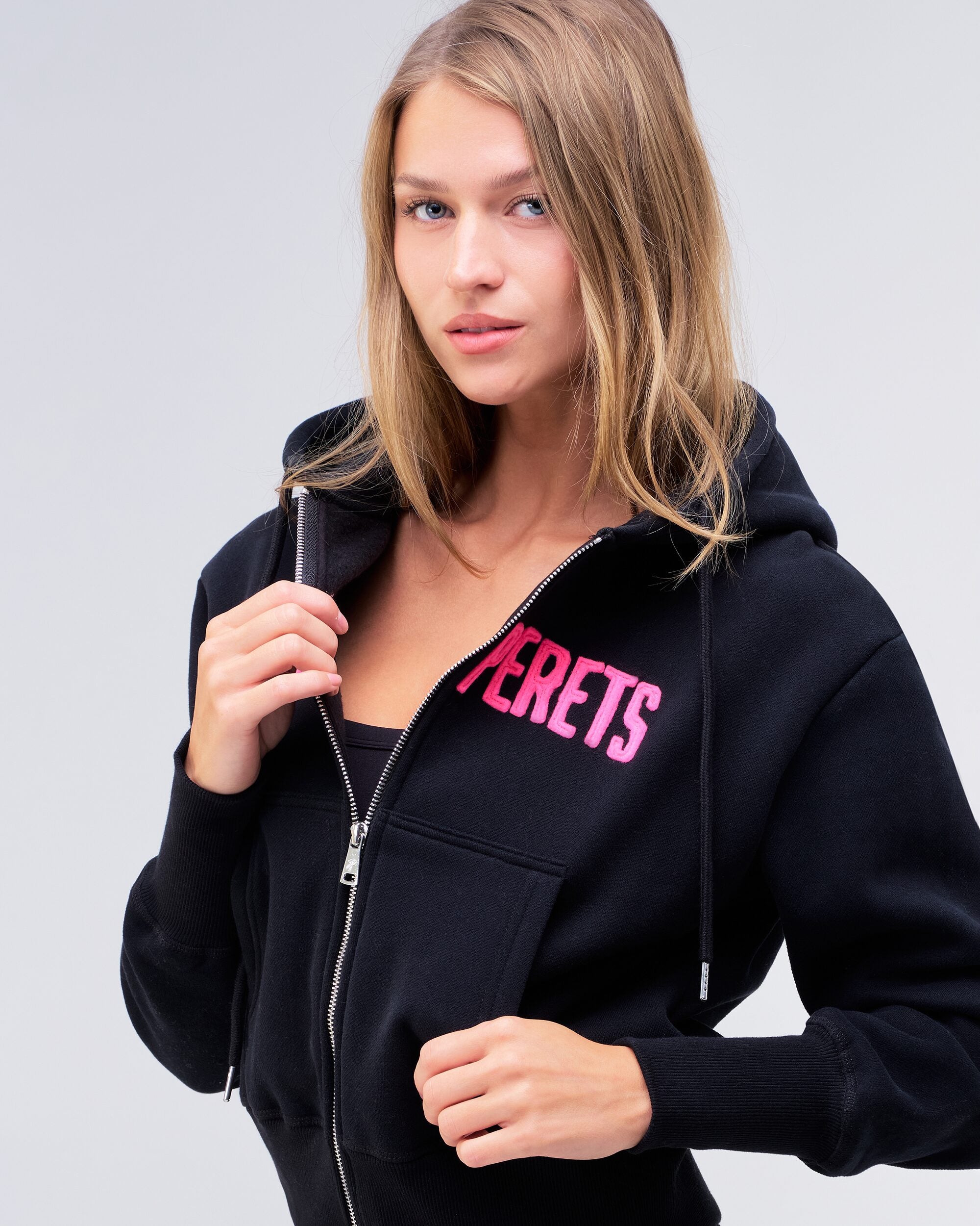 Paige relaxed-fit zip-up hoodie in black with pink logo, front view