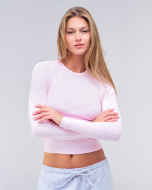 Alexa fitted crew neck long sleeve top in baby pink, three-quarter view