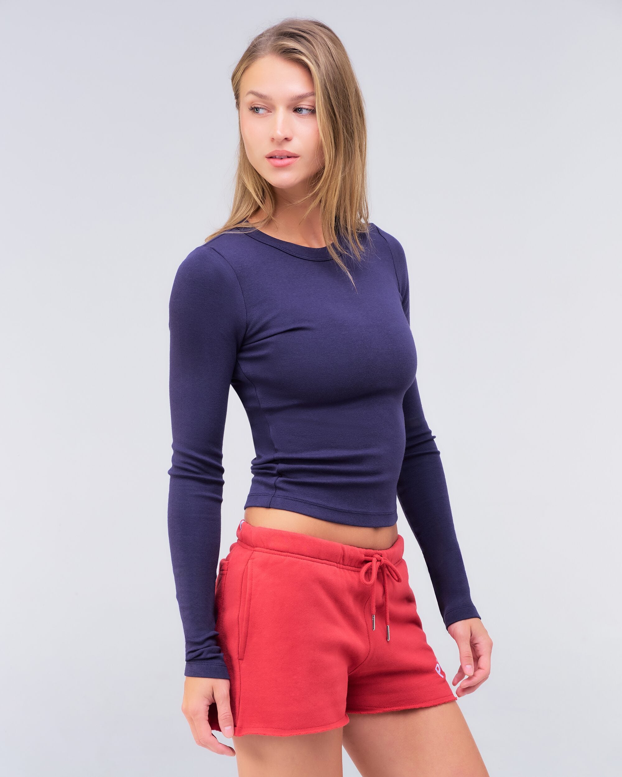 Alexa fitted crew neck long sleeve top in navy, three-quarter view