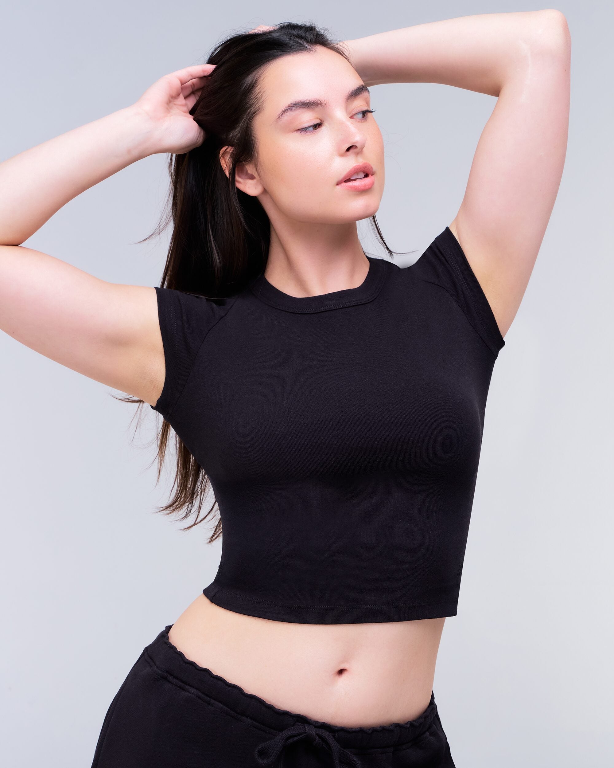 Daisy Fitted Crew Neck Tee in Black - raised arms