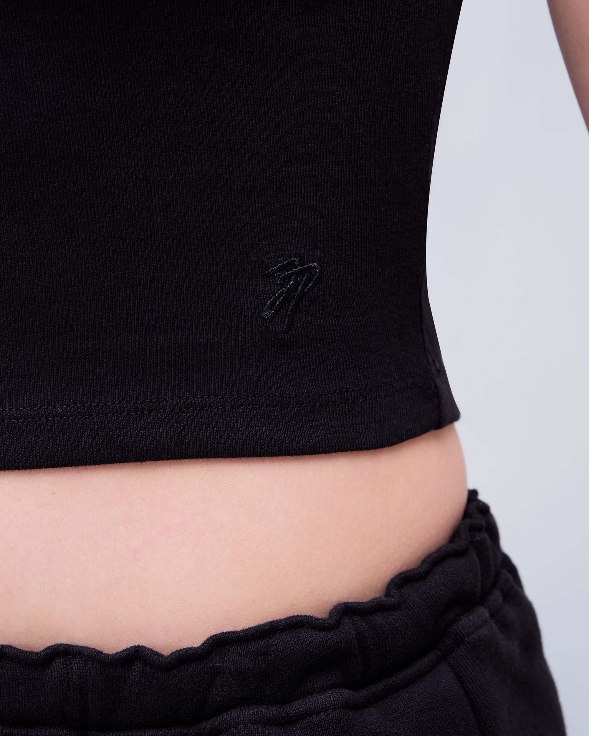 Daisy Fitted Crew Neck Tee in Black - hem logo detail