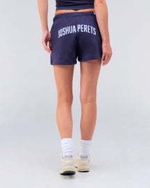 Danna relaxed sweat short in navy, back view walking