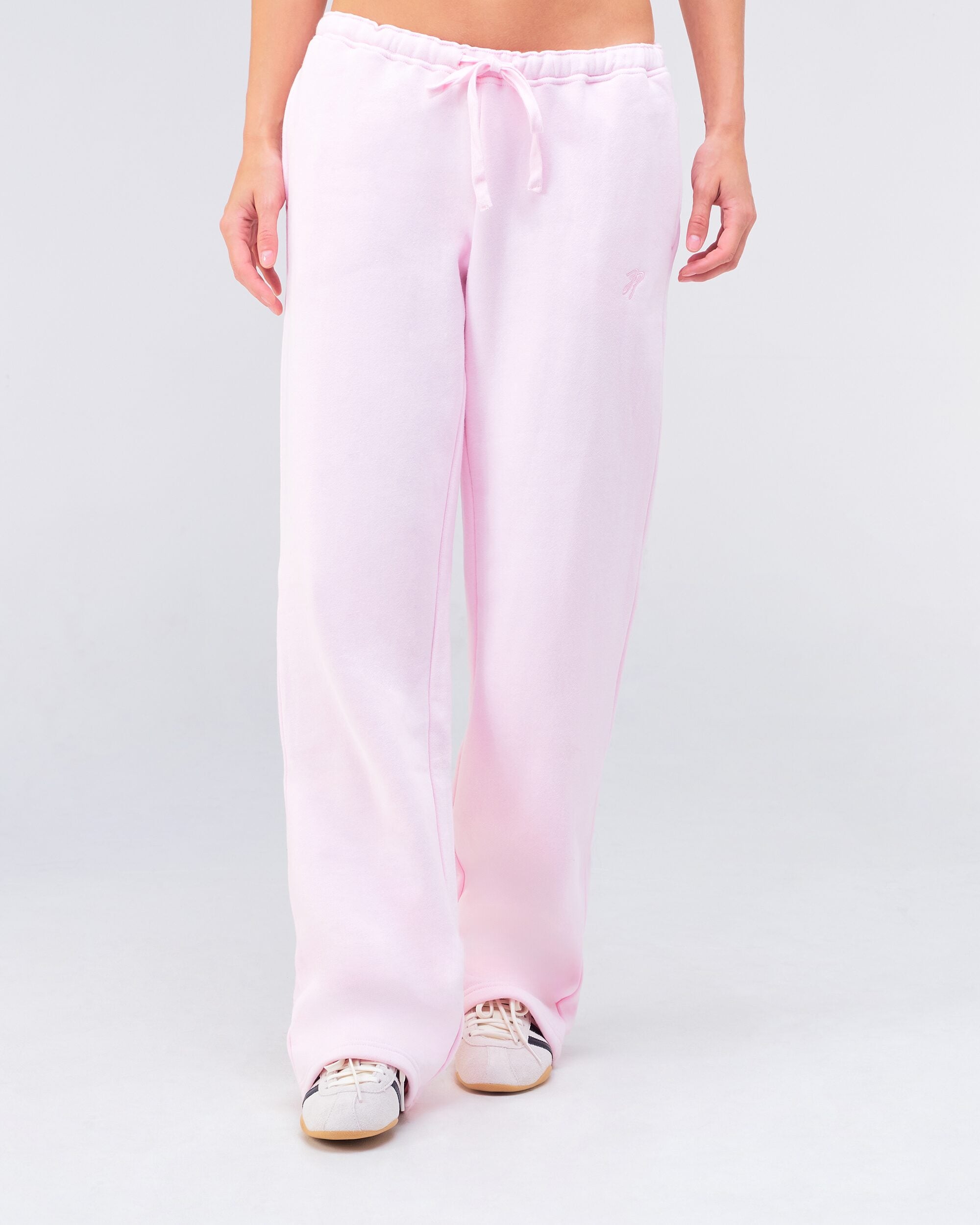 Gia Low-Rise Relaxed Fit Flared Sweatpants in Baby Pink - front