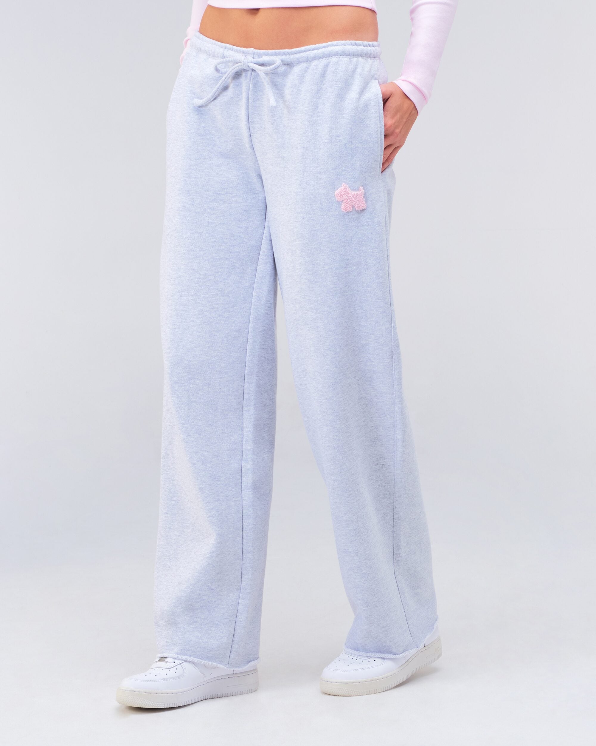 Gracie low-rise oversized flare pants in grey mix, front view with hand in pocket
