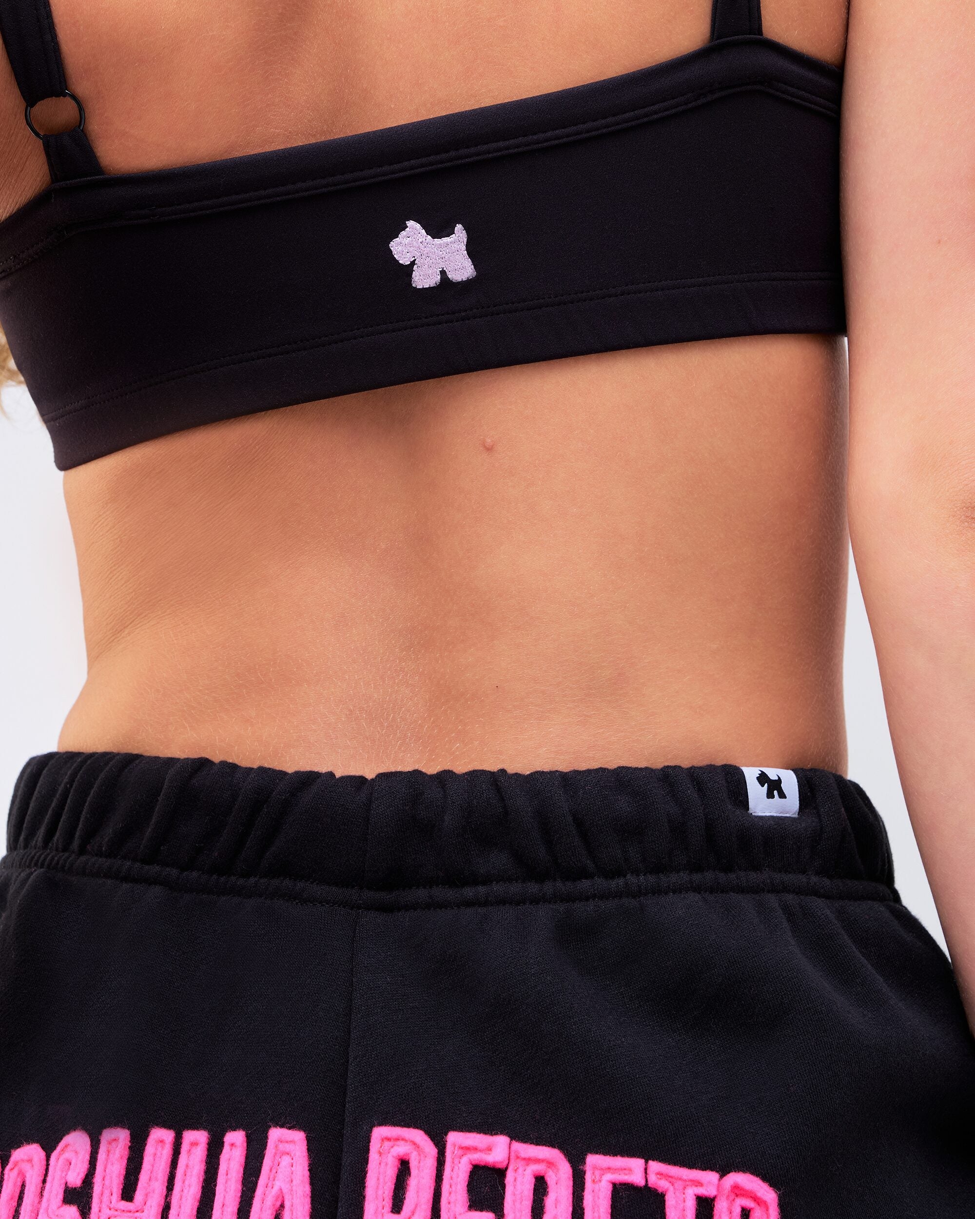 Reyna Fitted Sports Bra in Black - logo detail