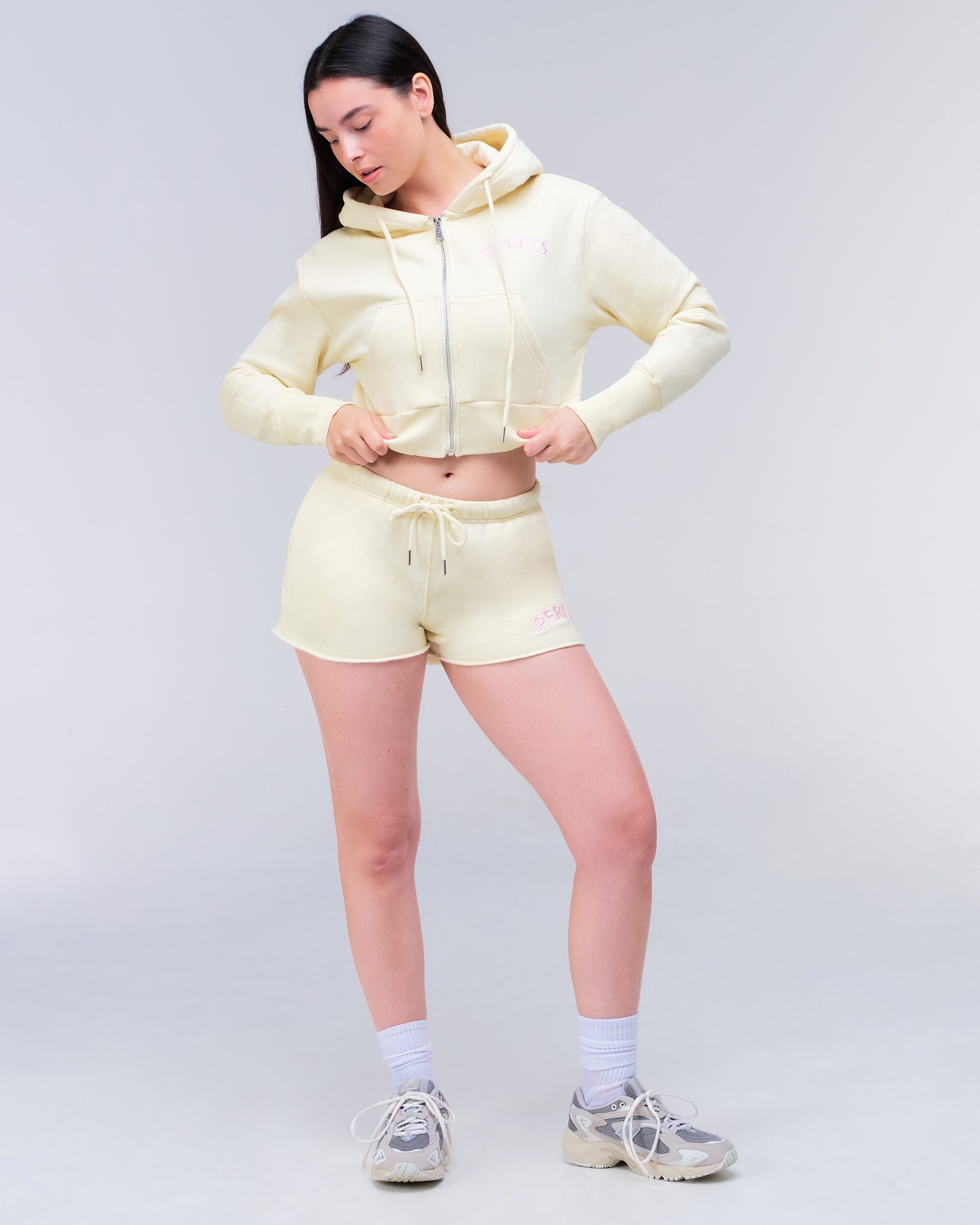 Rosalie Low-Rise Loose Fit Shorts in Yellow - styled with hoodie