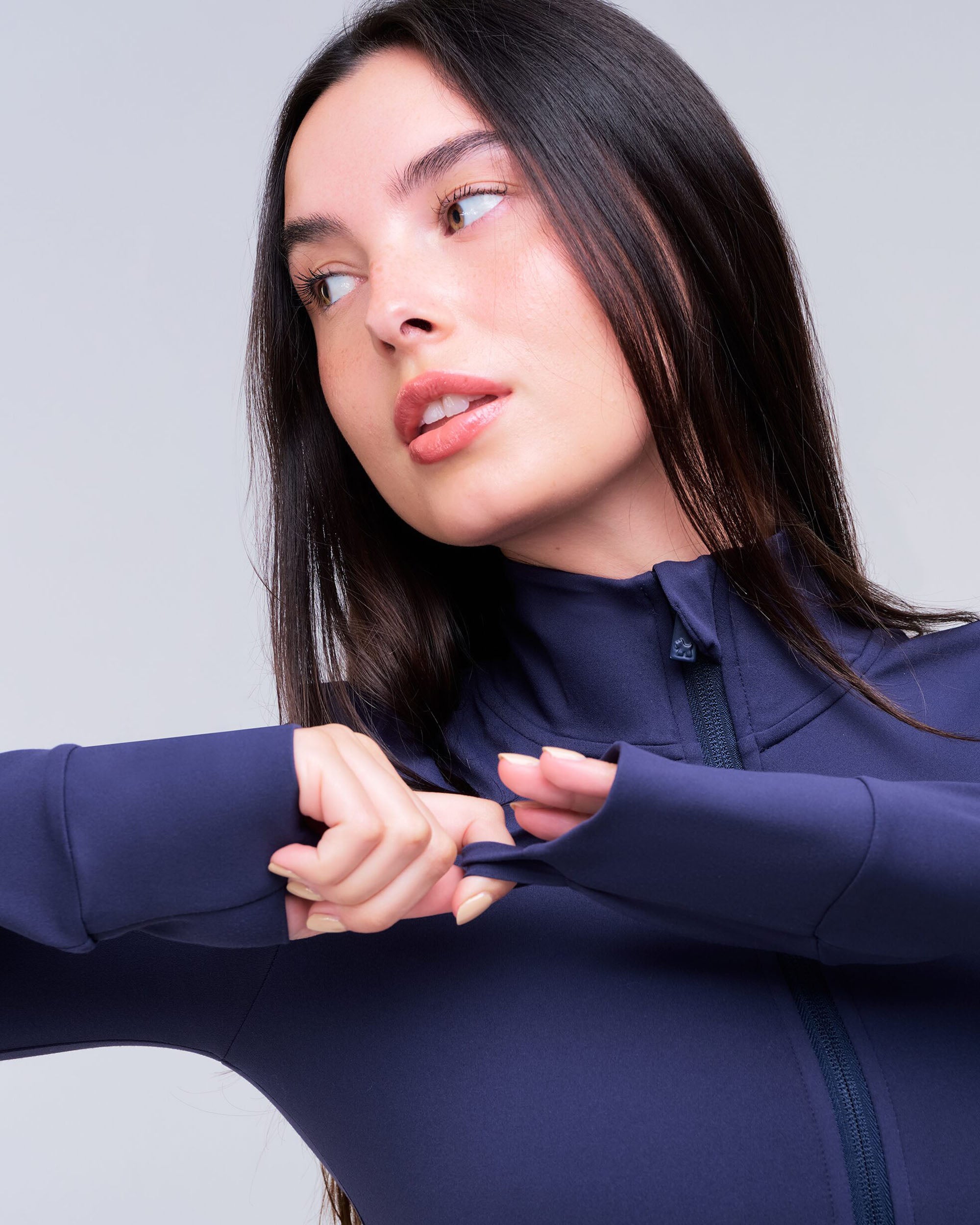 Shay Fitted Mock Neck Zip-Up Long Sleeve Top in Navy - cuff detail